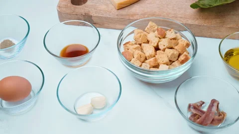 Caesar Salad and Sauce ingredients in 4k on the table ready for preparation. Stock Footage 140762818