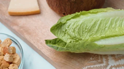 Caesar Salad and Sauce ingredients in 4k on the table ready for preparation. Stock Footage 140762854