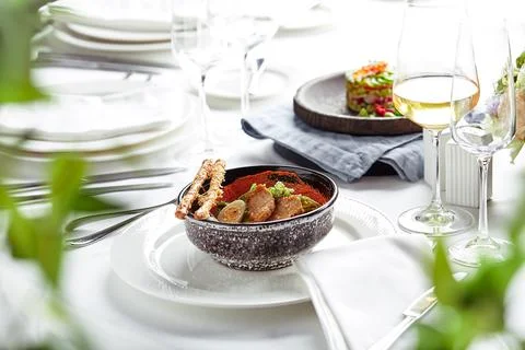 Caesar salad with bread sticks, quail eggs, cherry tomatoes and grilled chicken Stock Photos