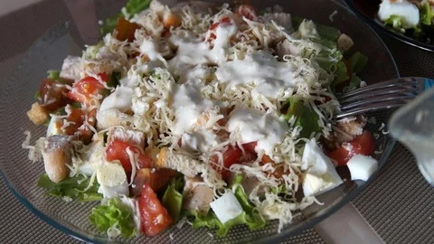 Caesar salad. Chef cooking caesar. Cooking process. Fresh salad. Chicken Caesar Stock Footage 100106909