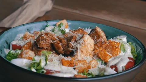Caesar Salad with Chicken, Parmesan Cheese and Croutons Stock Footage 284845689