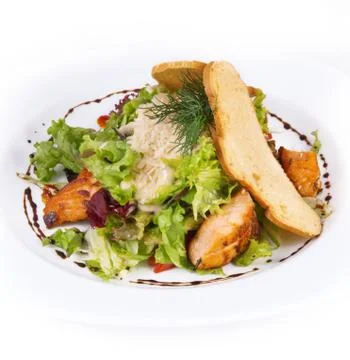 Caesar salad with chicken on a plate Stock Photos
