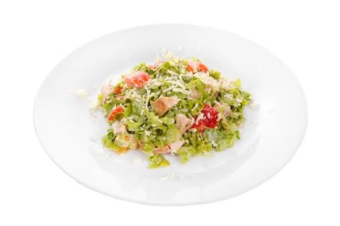 Caesar salad with chicken on plate white isolated Stock Photos