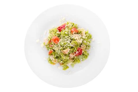 Caesar salad with chicken on plate white isolated Stock Photos