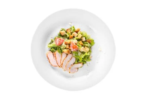 Caesar salad with chicken on plate white isolated Stock Photos