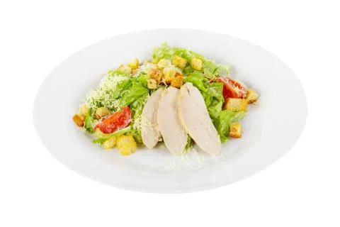 Caesar salad with chicken on plate white isolated Stock Photos
