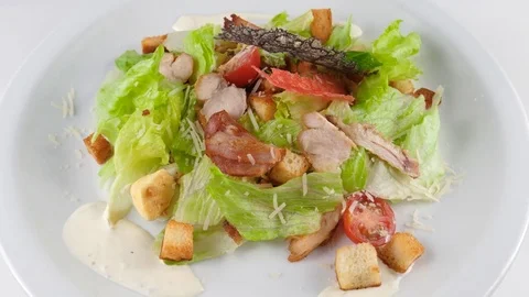 Caesar salad with chicken, served with parmesan cheese, bacon and croutons Stock Footage 80982164