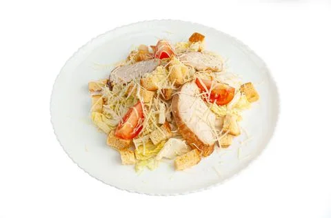 Caesar salad with Chinese cabbage. In a white plate. View from above. White b Stock Photos