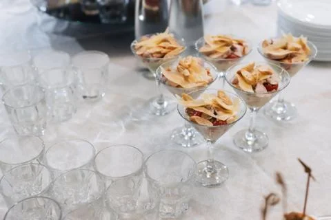 Caesar salad with crackers, cheese, chicken and tomato in glasses for a snack Stock Photos