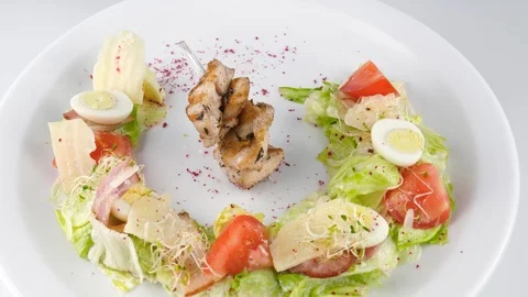 Caesar salad, creative design of the dish, served in restaurant Stock Footage 94210078