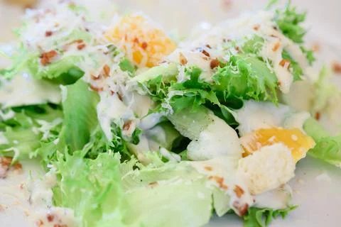 Caesar salad with crispy bacon Stock Photos