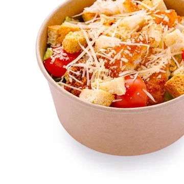 Caesar salad with crispy chicken in takeaway bowl Fotos de archivo