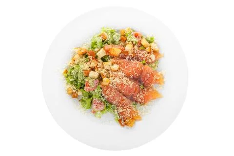 Caesar salad with fish on plate white isolated Stock Photos