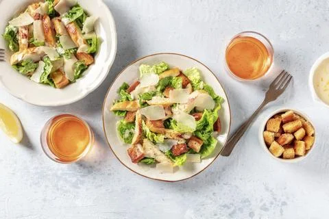 Caesar salad, a flat lay shot with wine and croutons Stock Photos