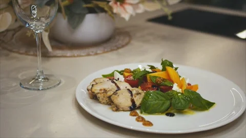 Caesar salad with fresh greens, cherry tomatoes and grilled chicken Stock Footage 154999073