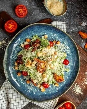 Caesar salad with fried chicken and crackers Stock Photos