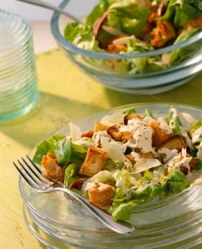 Caesar salad with garlic dressing and croutons Stock Photos