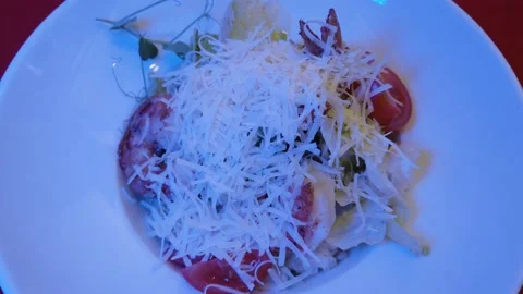 Caesar salad with grated parmesan, top view. Static footage. The salad plate  Vídeos de archivo 202239631