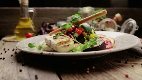 Caesar salad with grilled cheese and tomatoes. Varieties of Caesar salad. Stock Footage 80991860