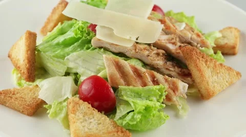Caesar salad with grilled chicken, cherry tomatoes, croutons Stock Footage 56429174
