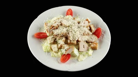 Caesar salad with grilled chicken, loop, top view Stock Footage 61710442