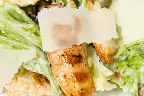 Caesar salad with grilled chicken. Stock Photos