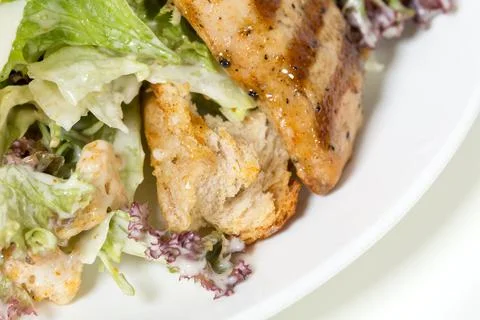 Caesar salad with grilled chicken. Stock Photos