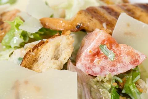 Caesar salad with grilled chicken. Stock Photos