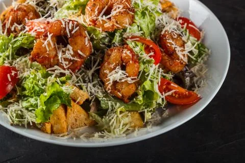 Caesar Salad with King Prawns, Cherry Tomatoes and Cheese Parmesan Stock Photos