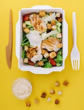 Caesar salad packed on craft box for take away Stock-Fotos