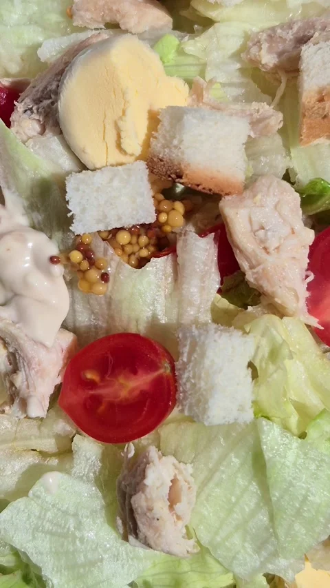 Caesar salad in a plate close-up Video stock 309999965