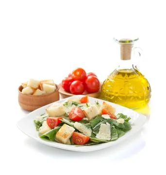 Caesar salad in plate on white background Foto stock