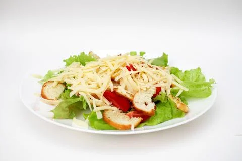 Caesar salad in a plate on a white background Fotos de archivo