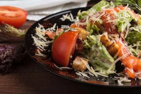 Caesar salad with salmon and cherry tomatoes 스톡 사진