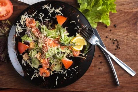 Caesar salad with salmon and cherry tomatoes Stock Photos