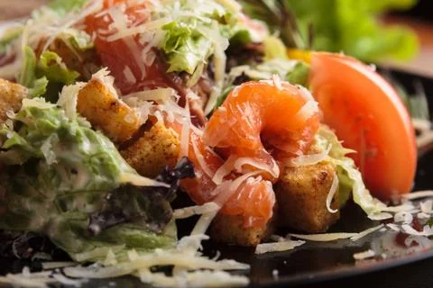 Caesar salad with salmon and cherry tomatoes Stock Photos