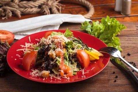 Caesar salad with salmon and cherry tomatoes Stock Photos