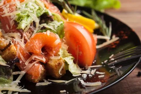 Caesar salad with salmon and cherry tomatoes Stock Photos
