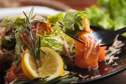 Caesar salad with salmon and cherry tomatoes Stock Photos