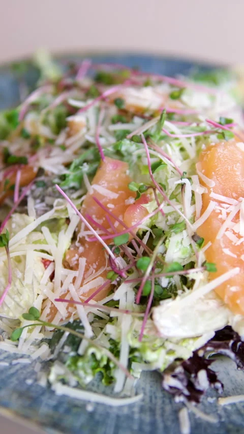 Caesar salad with salmon iceberg lettuce, BBQ turkey, bacon and tuna sauce with Stock Footage 319931964