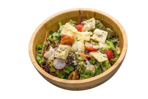 Caesar Salad served in a dish isolated on plain white background side view Stock Photos