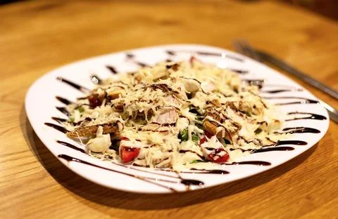 Caesar salad is served in the restaurant Stock Photos