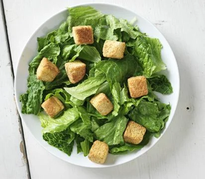 Caesar salad shot from top down view Stock Photos