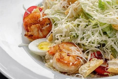 Caesar salad with shrimps, close-up Stock Photos