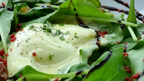 Caesar salad with soft boiled egg Stock Footage 80075937