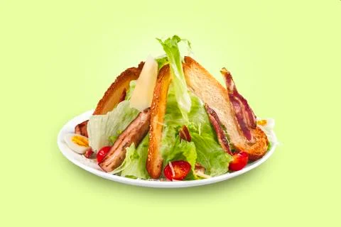 Caesar Salad on a stele green background Stock Photos