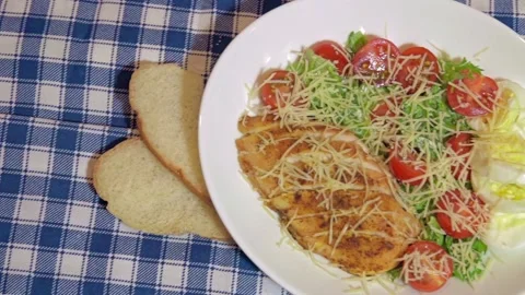 Caesar salad with white brad and lemon slices Video stock 143591405