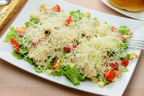 Caesar Salad on white dish Stock Photos