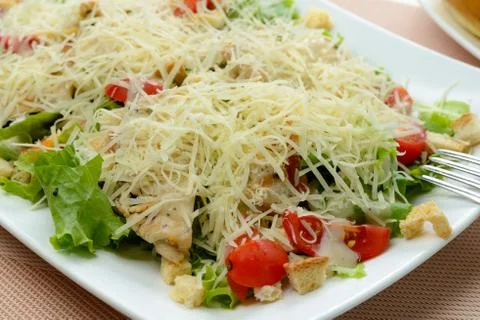 Caesar Salad on white dish Stock Photos