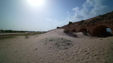 Caesarea Maritima dune and old bridge, 2023 Stock Footage 299332344